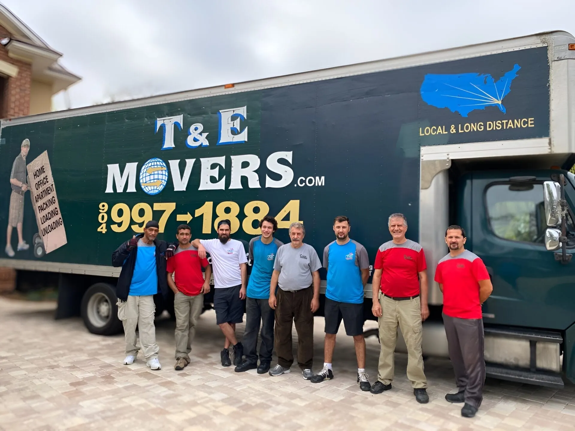 T&E Moving team standing with company truck in Jacksonville
