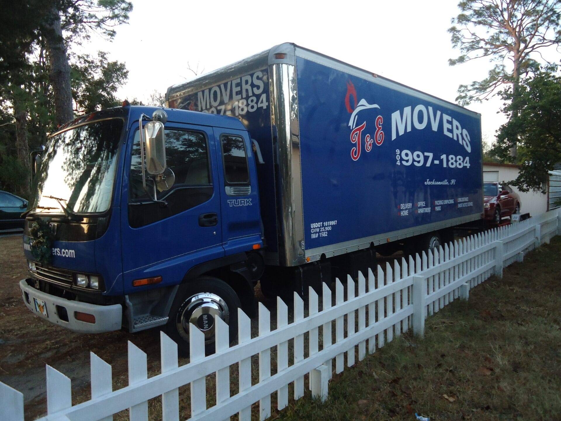 T&E Movers truck parked in front of a Jacksonville home